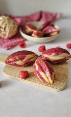 raspberry cookies on a wooden cutting board