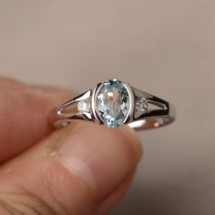 This is a gorgeous handmade creation. Its beauty is its simplicity & Elegance. The 6*8mm oval shape faceted natural aquamarine is crafted in solid sterling silver and with rhodium plated. All item is sent in a beautiful gift box If you have any idea of design your ring,pls contact me directly. You can realize more lovely stuff clicking the link https://www.etsy.com/shop/knightjewelry?refshopsection_shophome_leftnav Please leave the correct address and you phone number for delivering successf Half Bezel, Cubic Zirconia Engagement Rings, Sterling Silver Wedding Rings, Aquamarine Engagement Ring, Wedding Rings Solitaire, Aquamarine Rings, Ring Ideas, Girly Jewelry, Womens Engagement Rings