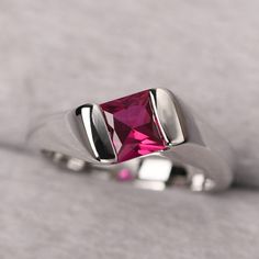 ◆ The ring is handcrafted from sterling silver and decorated with a dazzling 6*6 mm ruby. It is suitable for engagement/anniversary/daily occasion. ◆ Production Description: Main stone Type: Lab Ruby Main Stone Shape: Princess Cut Main Stone Size: 6*6 mm (1.38ct) Side stone: None Metal: 925 Sterling silver - Other options available in the drop down menu ◆ Customization: √Free for Add Engraving √Other Metal Type Available √Other Gemstones & Shapes Available √Personalization Requests Available Formal Red Birthstone Ring With Polished Finish, Formal Red Polished Birthstone Ring, Open Ruby Ring With Prong Setting For Anniversary, Modern Ruby Birthstone Ring For Anniversary, Gift Ruby Ring With Center Stone, Classic Silver Ruby Ring For Valentine's Day, Formal Birthstone Ring With Lab-created Ruby, Pink Ruby Birthstone Ring For Anniversary, Classic Lab-created Ruby Promise Ring