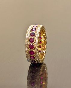 DeKara Designs Collection Metal- 18K Yellow Gold, .750. Stones- 20 Genuine Round Rubies 2.40 Carats, 120 Round Diamonds F-G Color VS1 Clarity 0.55 Carats. Entirely Handmade 18K Yellow Gold Eternity Diamond Round Ruby Engagement Band. This band is extremely elegant featuring beautiful and fiery rubies that are all professionally burnish set individually with amazing bead work surrounding each stone. There are 60 professionally pave set round diamonds on the top and bottom of band, which gives the Wedding Ruby Eternity Band In Yellow Gold, Classic Ruby Eternity Band For Wedding, Luxury Wedding Eternity Band With Pave Setting, Wedding Yellow Gold Ruby Eternity Band, Luxury Wedding Eternity Band, Luxury Ruby Jewelry For Wedding And Anniversary, Wedding Ruby Eternity Band In Fine Jewelry Style, Ruby Eternity Band For Wedding, Luxury Cubic Zirconia Eternity Band For Wedding