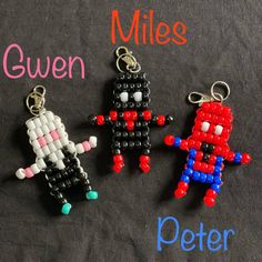 three beaded key chains with the words miles, queen and peter on them