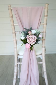 a chair decorated with pink and white flowers