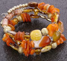 Multi-layered natural stone boho bead magnetic closure memory wire bracelet Materials: natural stone, bead, gold-plated alloy, memory wire Colors: Orange, gray Memory Wire Bracelets Tutorial, Memory Wire Jewelry, Mountain Jewelry, Wire Bracelets, Beads Bracelet Design, Wire Wrapped Bracelet, Memory Wire Bracelets, Natural Stone Bracelets, Unique Jewelry Designs