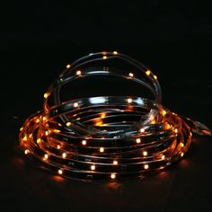 an orange led strip light on a black background