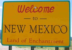 a welcome to new mexico sign in the desert