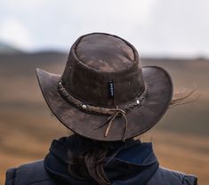 "Genuine leather hats, Personalized hats from Wombat Outdoor Leather style Australian Bush Hats For any campers or hikers planning their trips during the spring and summer check out this rugged camouflage brown leather hat which we have called The Wilds. It is the perfect hat to take away with you on holiday, as the soft foldable/crushable leather allows it to be packed away without taking up too much or affecting the shape when you take it back out. The hat stays looking strong and durable with the worn effect giving it a classically aged appeal. When you head out into the country to explore the wide open spaces you need accessories that are functional and this soft leather hat ticks those boxes while also being incredibly stylish. Not only that, but the unique leather grain found on each Country Style Wide Brim Top Hat For Outdoor, Rugged Hunting Hat With Curved Brim, Rugged Flat Brim Hunting Hat, Rugged Leather Hat With Flat Brim, Rugged Leather Hats For Outdoors, Leather Fedora For Hunting, Rugged Brimmed Hat For Country Events, Rugged Leather Hat For Outdoor, Rugged Brown Hat For Outdoor Activities