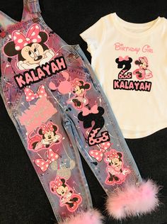 a pair of overalls with minnie mouse on them