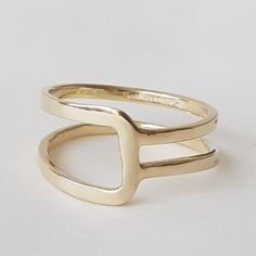 14K solid gold ring in a minimalist style for lovers of geometric shapes.◈ DETAILSWeight: 3gWidth upper part-9mm / 0.35''Thickness-1.3 mm / 0.05''◈ MATERIAL14K Solid Gold - Smooth,shiny,plain surface◈ ALSO AVAILABLE IN 14K/18K/9K Yellow, Rose, or White Gold◈ ENGRAVING is optional◈ SHIPPING is insured express and free worldwide◈ GIFT WRAPPING is included with every purchase✧ Back to my shop for more handcrafted gold jewelry:https://etsy.me/38Cs5ZlIf you have any questions, I will be happy to help Adjustable Modern Initial Ring In 14k Gold, Modern Adjustable 14k Gold Initial Ring, Modern Adjustable Initial Ring With Open Design, Modern Adjustable Initial Open Ring, Modern Adjustable Stackable Rings With Open Band, Modern Adjustable Initial Ring For Everyday, Modern Adjustable Stackable Rings With Simple Design, Modern Stackable Rings In Recycled Gold For Anniversary, Adjustable Yellow Gold Stackable Rings Modern Style