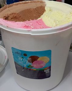 three different types of ice cream in a bucket