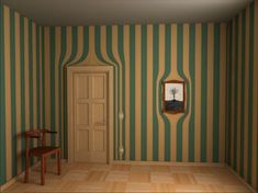 an empty room with green and white stripes on the walls, two tables and a mirror