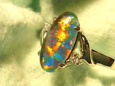 "When I first started in the Opal Trade 50 odd years ago, the 12 x 6 mm Oval Shaped stone was extremely popular. The long ,narrow, Oval shape lent itself perfectly to Pendants, Drop Earrings but particularly for Ring designs. The shape naturally follows the line of the finger  & looks elegant despite it's size, compared to rings featuring wider stones. In the last few decades 12 x 6mm Oval has virtually disappeared from the Opal Jewellery market & is rarely seen, try Googling it. I've decided to Jewellery Market, Opal Jewellery, Opal Ring Gold, Jewellery Marketing, Oval Rings, Opal Ring, Australian Opal, Diamond Design, Opal Jewelry