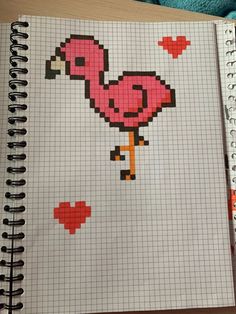 a pink flamingo cross stitched into a notebook