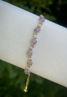 Stress relief * Self love * Intuition - 2mm beads  - Gold plated  - Adjustable - Unique and thoughtful gift idea!  Please don't hesitate to contact me if you have any questions! Beaded Bracelets Purple, Elegant Amethyst Crystal Bracelet, Elegant Handmade Lavender Crystal Bracelet, Dainty Purple Gemstone Bracelets, Dainty Flower-shaped Beaded Crystal Bracelet, Elegant Flower-shaped Beaded Crystal Bracelet, Daisy Flower Bracelet, Lavender Jewellery, 2mm Beads