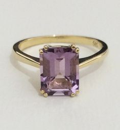 This stunning cocktail ring is set with a luscious, purple amethyst, which really flashes and flickers with vibrant violet reflections! Set into a lovely vintage mounting with simple. This ring is a beautiful addition to anyone's collection. Metal: 14K Yellow Gold Gem: Amethyst 0.36 x 0.28 inch (9.2 x 7.2 mm) Weight: 2.8 gr. -------------- Material options ------------------ - 14k and 18k White gold and Yellow gold, Platinum, and sterling silver - Can be made with different size Gemstones (Ask f Self Love Ring, Radiant Rings, Lilac Amethyst, Gem Engagement Rings, Ring For Mom, Ring Rectangle, Amethyst Cocktail Ring, Rectangle Ring, Engagement Ring Solitaire