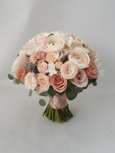 a bouquet of pink and white flowers on a white background