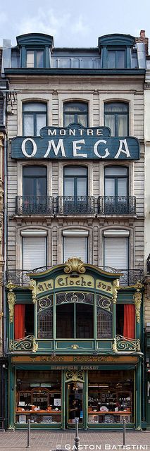 an old building that has been converted into a restaurant in the middle of it's street