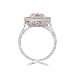 This stunning ring features a beautiful emerald cut Kunzite with a beautiful pink hue. Surrounding the center gemstone is a row of French-cut rubies and diamond baguettes. ✦ KUNZITE SPECIFICATIONS: Kunzite Cut: Emerald Cut Kunzite Weight: 4.00 Carats ✦ ENGAGEMENT RING SPECIFICATIONS: Ring Material: Platinum Stones: Diamond, Kunzite, Ruby ✦ WHAT COMES IN YOUR SHIPMENT: - Your Engagement Ring - Quality Ring Box - Jewelry Cleaner - UGL Certificate ✦ WHY SHOP WITH US: - We've been in business for 40 Classic Emerald-cut Pink Ruby Ring, Pink Emerald-cut Jewelry With Halo Setting, Pink Emerald-cut Diamond Ring With Center Stone, Pink Emerald-cut Diamond Ring With Accents, Luxury Emerald-cut Ruby Ring With Diamond Accents, Belt Ring, Estate Diamond Jewelry, Ruby Engagement Ring, Baguette Cut Diamond