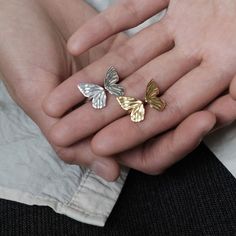 Why We Made This Adorn your fingers with the timeless beauty of our Adjustable Butterfly Ring, meticulously crafted in sterling silver and available in both silver and gold finishes. This exquisite piece of jewelry seamlessly combines elegance with versatility, making it a perfect accessory for any occasion. Designed to fit most finger sizes, providing comfort and flexibility. The ring features a stunning butterfly motif, delicately etched for a captivating and enchanting look. Product Details M Elegant Sterling Silver Midi Rings For Anniversary, Elegant Nickel-free Open Ring, Elegant Nickel-free Gold Rings, Elegant Silver Nickel-free Stackable Rings, Timeless Silver Sterling Midi Rings, Elegant White Sterling Silver Midi Rings, Fine Jewelry Adjustable Butterfly Open Ring, Adjustable Fine Jewelry Butterfly Open Ring, Adjustable Butterfly Open Ring Fine Jewelry