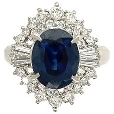 For Sale on 1stDibs - Simply Beautiful! Blue Sapphire and Diamond Art Deco Revival Platinum Ring. Centering a securely set Oval Sapphire, weighing approx. 3.34 Carat, surrounded Gia Certified Sapphire Cluster Jewelry, Gia Certified Oval Collectible Ring, Art Deco Sapphire Jewelry Gia Certified, Gia Certified Blue Art Deco Jewelry, Blue Art Deco Jewelry Gia Certified, Platinum Sapphire Multi-stone Jewelry, Collectible Oval Sapphire Ring In Platinum, Collectible Sapphire Diamond Jewelry, Collectible Fine Jewelry Sapphire Ring