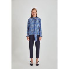 Add a pop of color to your wardrobe with the Amanda Blouse. This silk top comes styling a bow neckline for a vintage aesthetic with the long button cuff sleeves providing a touch of formality. A simple style that can be slipped on for a whole manner of occasions, wear with your favorite pair of plain trousers or jeans. 100% Silk  Professional Dry Clean Only Blue Silk Blouse With Blouson Sleeves, Silk Floral Print Top For Work, Chic Spring Blouse For Semi-formal Occasions, Elegant Floral Print Tie Neck Blouse, Chic Blue Blouse With Tie Sleeves, Blue Long Sleeve Tops With Tie Sleeves, Chic Semi-formal Spring Blouse, Chic Blouse With Tie Sleeves And Neck, Chic Silk Blouse For Business Casual