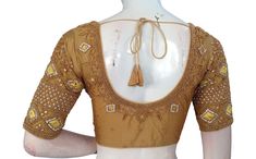 Adorn your bridal ensemble with this breathtaking handcrafted Indian silk saree blouse, meticulously crafted in the USA and embellished with the radiant artistry of gold-colored Aari embroidery. Made from the finest silk fabric, this blouse drapes gracefully, its rich texture complementing the intricate Aari work that adorns it. * This Is A Fully Stitched Saree Blouse, Ready To Wear * Made of Semi silk, Lined With Cotton * Opens From Front With Hook and eye-fitting MEASUREMENTS: Sleeve: 10.5 inc Gold Blouse Piece For Diwali Reception, Gold Embroidered Fabric For Designer Wear, Gold Anarkali Blouse Piece With Zari Work, Gold Art Silk Traditional Wear With Intricate Embroidery, Gold Embroidered Saree In Gold Color, Gold Embroidered Fitted Saree, Gold Traditional Wear In Art Silk With Intricate Embroidery, Gold Traditional Wear With Intricate Embroidery In Art Silk, Gold Embroidered Gold Saree