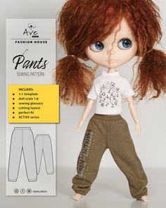 the doll is wearing pants and a t - shirt with an embellishment on it