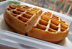 two waffles sitting on top of a plastic container