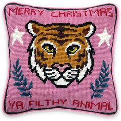 a pink pillow with a tiger on it's face and the words merry christmas ya filthy animal