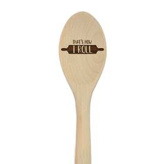 a wooden spoon with the words, that's how i roll on it