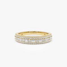 14K Gold Baguette Wedding Band: Featuring a Unique Combination of Prong-Set Baguettes and Micro-Pave Round Elements, This Stackable Ring Radiates Elegance. It is a perfect Half-Eternity Design for Layering or Stand-Alone Grace. ▶Features * Made to Order * Gold Kt: 14K (also available in 18K) * Available Gold Color: Rose Gold, Yellow Gold, White Gold * Round Diamond: 50 pcs 1.0 MM  * Round Diamond: 8 pcs 1.3 MM  * Baguette Diamond: 7 pcs 2.5 x1.3 MM  * Total CTW: 0.40ctw  *  Diamond Color-Clarity Classic Half Eternity Baguette Cut Ring, Diamond White Baguette Cut Eternity Band, Elegant Half Eternity Baguette Cut Rings, Timeless Baguette Cut Half Eternity Diamond Ring, Timeless Emerald Cut Eternity Band For Wedding, Timeless Emerald Cut Wedding Eternity Band, Baguette Cut Half Eternity Band, Diamond White Eternity Band With Baguette Diamonds For Anniversary, Round Eternity Band With Baguette Diamonds