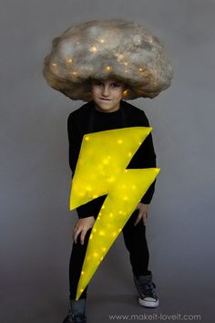 a boy with a cloud on his head and lightning bolt coming out of his hair