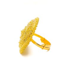 This 22k gold statement ring is a versatile and glamorous piece, weighing 9.0 grams with a polished yellow gold finish. With a 1.1-inch diameter, it fits a ring size of 6.25, adjustable from 5.25 to 7.25. The ring’s sleek and elegant design makes it a perfect accessory for any occasion, offering both style and adaptability. Ideal for those who appreciate understated luxury, this ring is a timeless addition to any jewelry collection. PRODUCT DETAILS Gold Purity(karat): 22k Gold Weight(grams): 9.0 Item Finish: Yellow Gold Ring Size: 6.25 Ring Diameter: 1.1" Adjustable Ring: Yes, Size 5.25 - 7.25 Traditional Gold Plated Rings For Formal Occasions, Elegant 22k Gold Ceremonial Rings, Gold Traditional Filigree Ring For Formal Events, Traditional Gold Filigree Ring For Formal Occasions, Ceremonial Adjustable Gold Engraved Ring, Elegant Ceremonial 22k Gold Rings, Adjustable Gold Engraved Ring For Formal Occasions, 22k Gold Open Ring Jewelry, Formal 22k Gold Filigree Ring