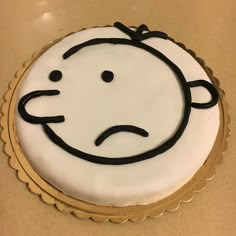 a cake with a face drawn on it