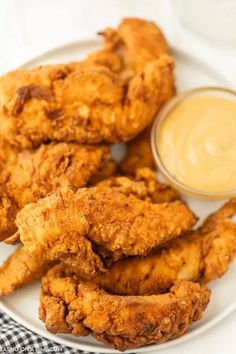 fried chicken on a plate with dipping sauce