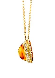 This beautiful necklace can be worn with anything, given its "gold on gold" colorway. It features a gorgeous 16.79 carat citrine square "sugarloaf" cabochon, whose rounded "sides" give the gemstone beautiful added dimension. The citrine is set in an exquisite, handmade 18k yellow bezel and is framed by a row of brilliant white diamonds. A second frame of pave set sparkling yellow sapphires echo the citrine's golden color and make this pendant stunning from all angles! The pendant measures 3/4" i Luxury Citrine Cabochon Jewelry, Luxury Formal Jewelry With Cabochon, Luxury Cabochon Jewelry For Formal Occasions, Elegant Amber Pendant Necklace, Gold Diamond Necklace With Cabochon, Diamond Cabochon Necklace For Anniversary, Formal Oval Amber Necklace, Luxury Diamond Jewelry With Cabochon Cut, Diamond Cabochon Pendant Necklace