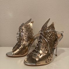 Brand New, Still In The Original Box, Sophia Webster Cherub Winged Lace-Up Mule In Rose Gold/Silver. Size 36.5, But Runs Small. Know Your Size/Fit. Original Price Was $650. Never Made It Out Of The Box. Comes With Sleepers And Box, If Wanted. Metallic Heels With Sculpted Heel, Gold Butterfly Shoes, Gold Heels With Butterflies, Sophia Webster Butterfly Heels, Sophia Webster Shoes, Sophia Webster, Mule, Made It, Shoes Women Heels