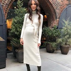 23 Cute Pregnancy Outfits Worth Copying | StayGlam Elegant Pregnancy Outfits, Cute Pregnancy Outfits, Sweater Dress With Boots, Pregnancy Outfit, Winter Maternity Outfits, Red Pleated Skirt, Bright Dress, Sweater Dress Outfit