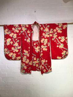 Circa 1920-30's Kinsha Silk  Haori (Red Silk Jacquard, Plum Blossom Pattern)  Hand made, hand sewn in Japan.  The jacket is crafted from kinsa(金紗), one of the highest quality silk jacquard textiles. It has a finer and smoother texture with more delicate shibo (the fabric's irregularities) compared to regular crepe with its soft and slightly shiny texture. Plum blossom represents strong perseverance, beauty, and hope for the New Year in Japanese kimono design. Period: Circa 1920-30's Material: Si Traditional Fitted Kimono With Kimono Sleeves, Vintage Floral Print Kimono For Wedding, Vintage Fitted Kimono With Kimono Sleeves, Vintage Red Kimono For Wedding, Vintage Spring Wedding Kimono, Vintage Silk Kimono For Wedding, Vintage Long Sleeve Wedding Kimono, Traditional Floral Print Kimono For Tea Ceremony, Red Vintage Kimono For Spring