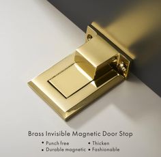 brass invisible magnetic door stop on white surface