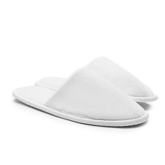 Our cozy slippers bring comfort to new levels with a softly cushioned interior and a minimalist look inspired by hotel luxury. Slip-on Soft Slippers For Relaxation, Soft Slip-on Slippers For Relaxation, Comfortable Slip-on Slippers With Soft Texture, Super Soft Slip-on Slippers For Lounging, Comfortable Soft Touch Slippers For Indoor Use, Comfy Slippers With Cushioned Footbed For Loungewear, Comfy Slip-on Slippers For Lounging, Comfortable Soft Touch Indoor Slippers, Comfortable Slippers With Textured Footbed