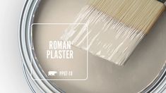 a paint can with a brush in it and the words roman plaster painted on it