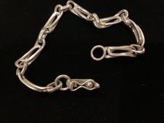 Beautiful vintage sterling silver chain link bracelet with a snap-lock closure. The bracelet has a beautiful design. It measures 8.25 inches in length. There are a few minor superficial scratches. Formal Sterling Silver Link Bracelet With Chain Detail, Formal Sterling Silver Link Bracelet, Formal Chain Link Bracelet With Clasp, Formal Link Chain Bracelet With Clasp, Formal Link Chain Bracelet With Sterling Silver Clasp, Hallmarked Sterling Silver Link Bracelet, Silver Oval Link Chain Bracelet With Hook, Formal Chain Link Bracelet With Sterling Silver Clasp, Formal Sterling Silver Bracelet With Clasp