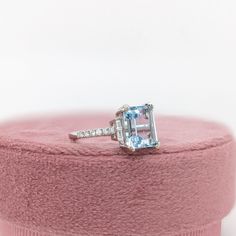 This beautiful ring features a 2.57 carat emerald cut Aquamarine gemstone with natural earth mined diamonds set in solid 14K gold. This Aquamarine ring makes a lovely March birthstone gift for your loved ones! This ring is made with solid 14K Gold and natural Earth mined SI / G-H diamonds. As listed, this ring is ready to ship. If you're interested in purchasing this setting with a different center stone please message us! Emerald-cut Topaz Ring In 14k White Gold, Timeless Emerald Cut Topaz Ring With Prong Setting, Timeless Emerald-cut Topaz Ring With Prong Setting, 14k White Gold Emerald-cut Topaz Ring, Radiant Cut Topaz Ring With Diamond In Prong Setting, Emerald Cut Topaz Ring In 14k White Gold, White Gold Topaz Ring With Prong-set Emerald Cut, Fine Jewelry Asscher-cut Topaz Ring With Diamond, Emerald Cut Topaz Ring With Prong Setting In Platinum