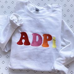 This trendy, unique, handcrafted Groovy Gildan embroidered crewneck sweatshirt is sure to stand out on any campus! Grab one for you, your big/little, or a group of sisters (bulk discount information can be found below). If you need some greek letter sweatshirt inspiration, please visit the inspiration page! Picture Details Pictures: ⭑ #1-3: White sweatshirt Care Instructions ⭑ Wash inside out on cold & air dry for best results ⭑ Do not dry clean ⭑ Light iron if necessary ⭑ Care instructions Sorority Stitched Letters Simple Sweatshirt, Sorority Embroidered Sweatshirt, Aoii Sweatshirt, Sweatshirt Inspiration, Alpha Gam, Sorority Sweatshirts, Sorority Big Little, Letter Sweatshirt, Big Little Gifts