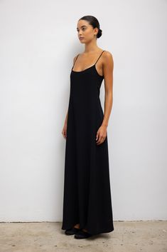 Crafted from our bestselling Rio Stretch Ponte, The Rio Maxi Tank Dress features a sweeping midi to maxi length, adjustable spaghetti straps, and a figure-skimming, cinched silhouette. Shop all styles in this fabric group Black Tank Dress, Maxi Tank Dress, Tank Dress, Spaghetti Strap, Fabric, Black