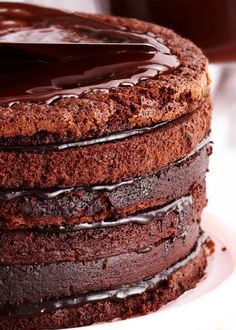 a chocolate cake is on a white plate