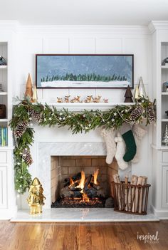 a fireplace decorated for christmas with stockings and stockings