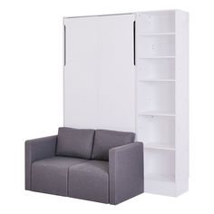 a couch and bookcase in front of a white wall mounted cabinet with shelving unit