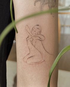 a person with a tattoo on their arm