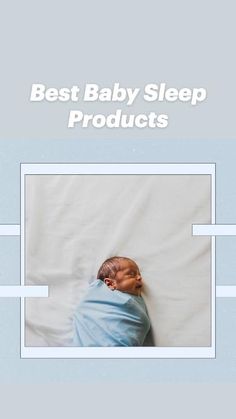 a baby wrapped in a blue blanket laying on top of a white sheeted bed